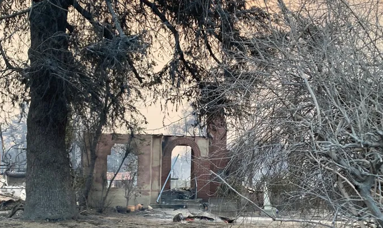 Deborah McGill and her family lost their home of 40 years. All that’s left is the doorway and chimney.